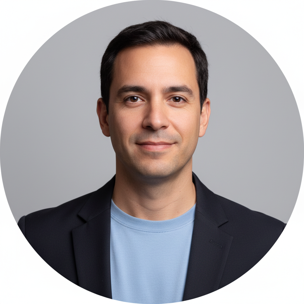 Realistic business portrait headshot of a Spanish or Latin American lighting designer in their 30s, wearing a simple shirt or light blazer, neutral expression with a slight friendly smile. Clean studio-style background in soft gray, with balanced, professional lighting that fits a premium commercial lighting brand. Framed in a centered square crop with shoulders and head visible, intended to be displayed as a small round testimonial avatar on a modern B2B website.